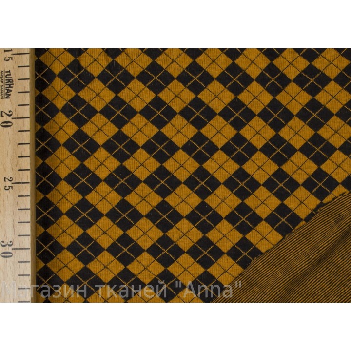 Трикотаж в шахматную клетку черно-желтого цвета