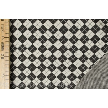 Трикотаж в шахматную клетку черно-белого цвета